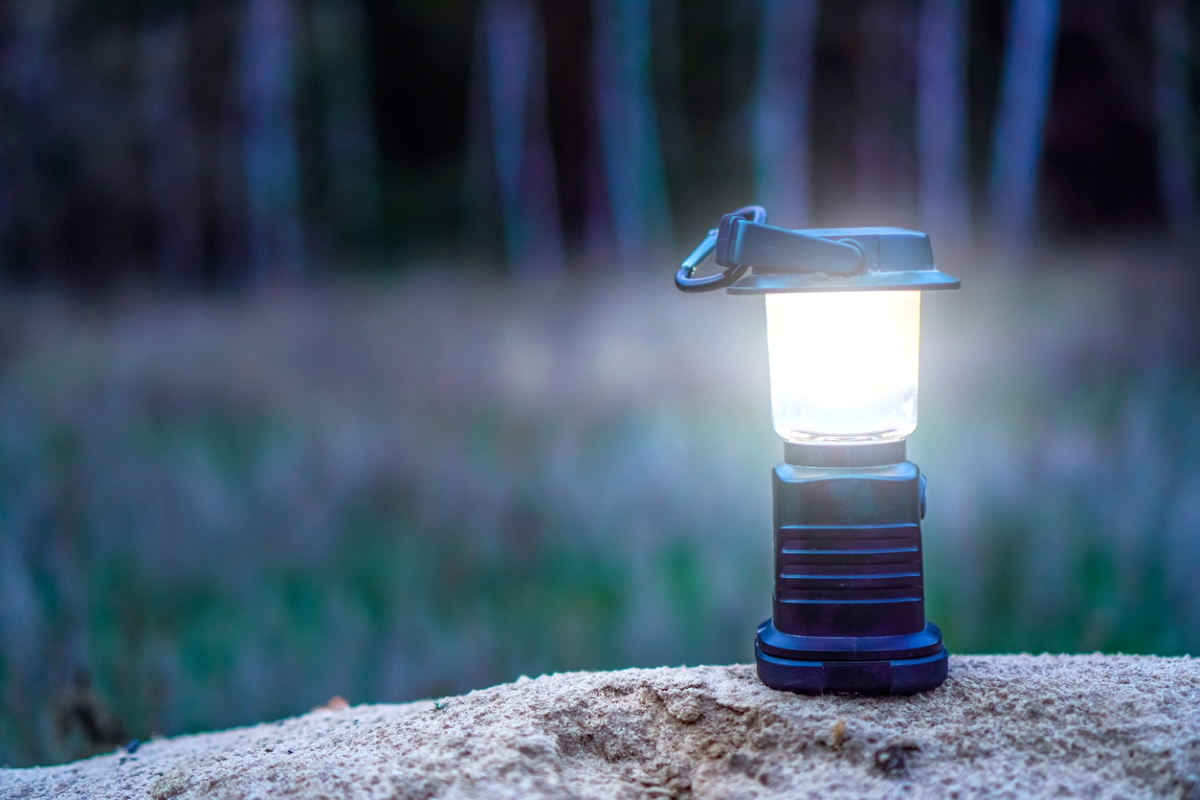 LED camping lantern on rock