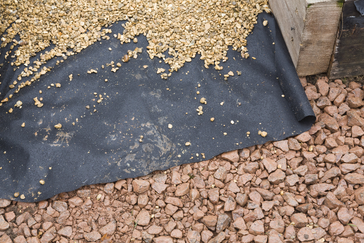 overhead view of landscaping fabric and gravel