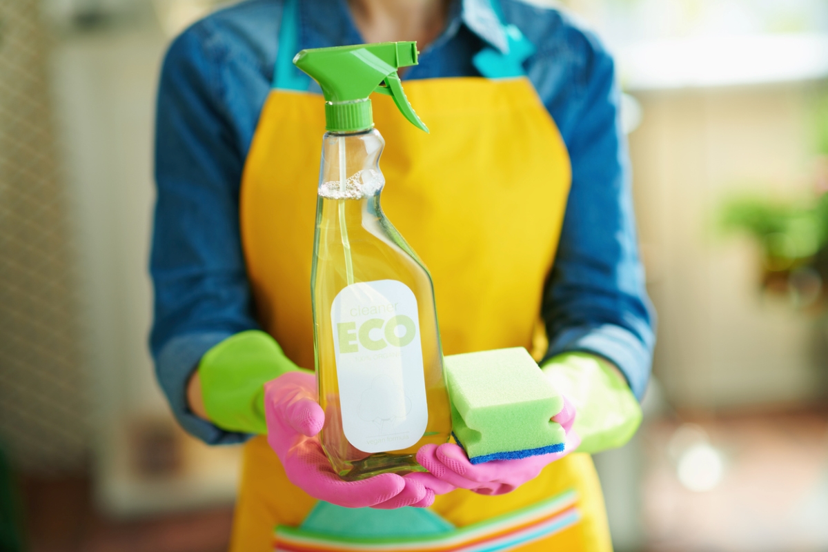 Woman holding eco-friendly cleaning product