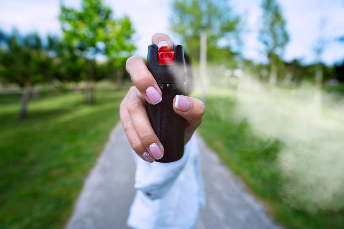 Person spraying pepper spray