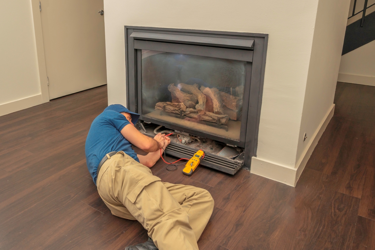 Technician working on electric fireplace