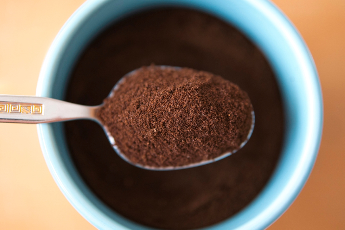 Coffee grounds on spoon
