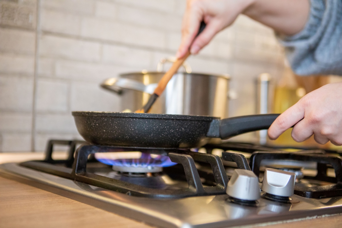 Person using non-stick pan to cook
