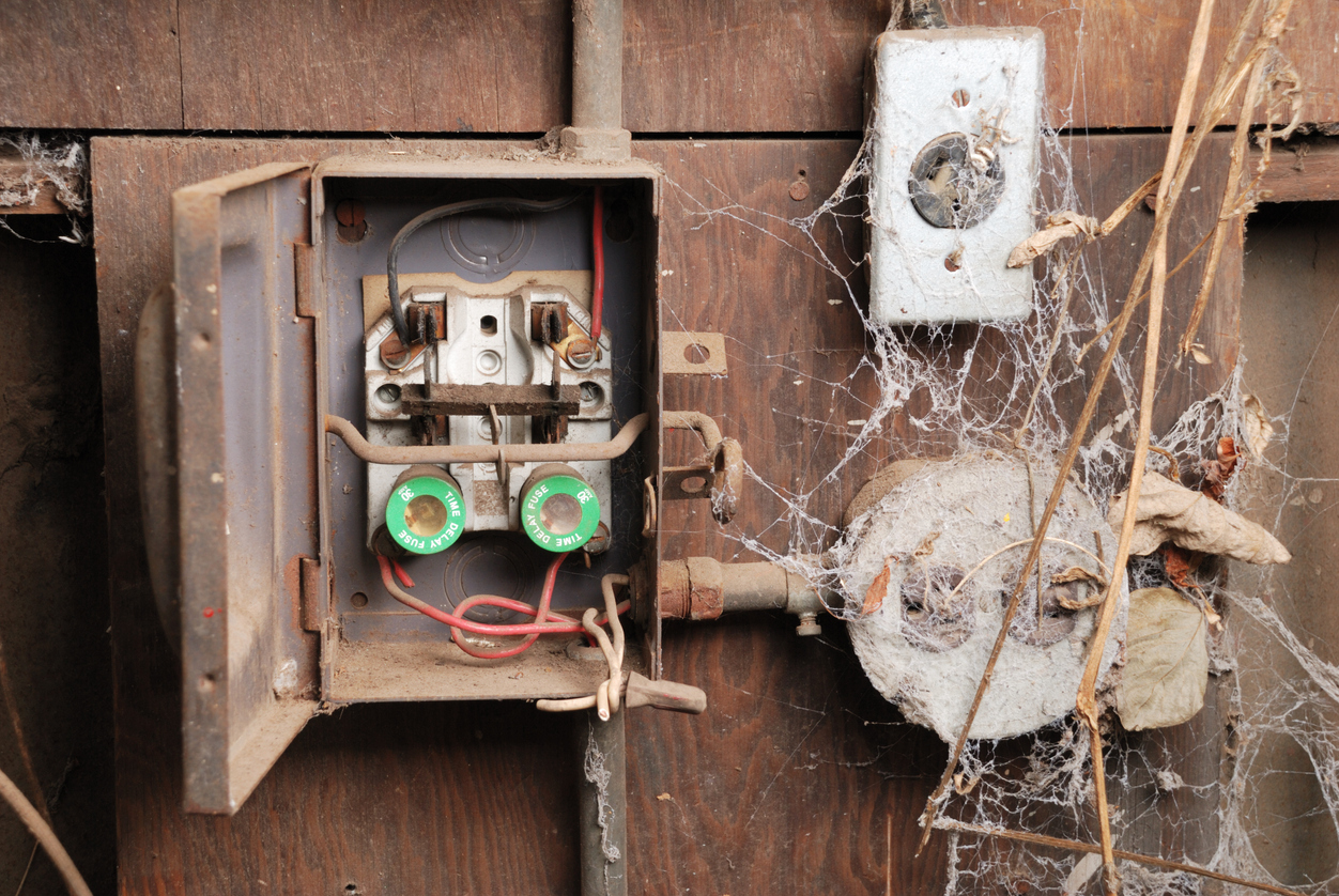 Fuse box with spider webs