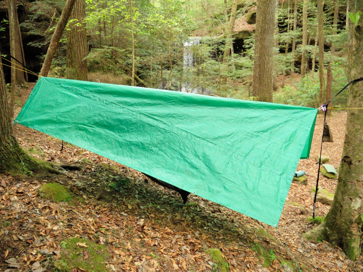 Green tarp over tent