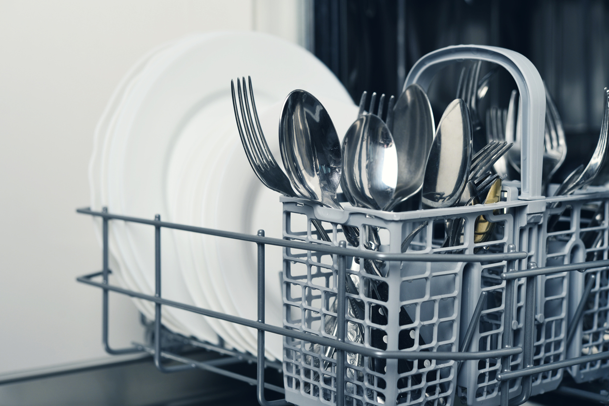 close view of silverware loaded into dishwasher