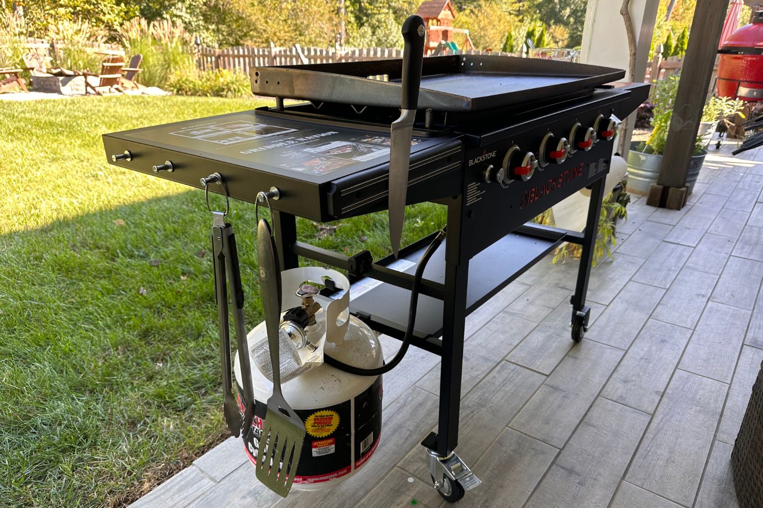 Blackstone 36-inch griddle in backyard with firepit.