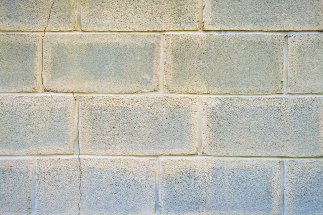 A close up of a grey brick wall.