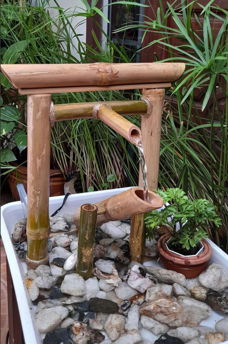 bamboo water fountain in garden