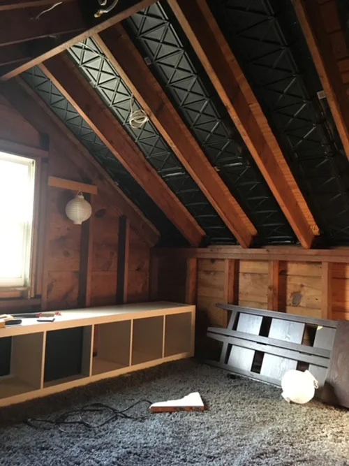 Renovation is in progress on an attic space to turn it into a playroom.