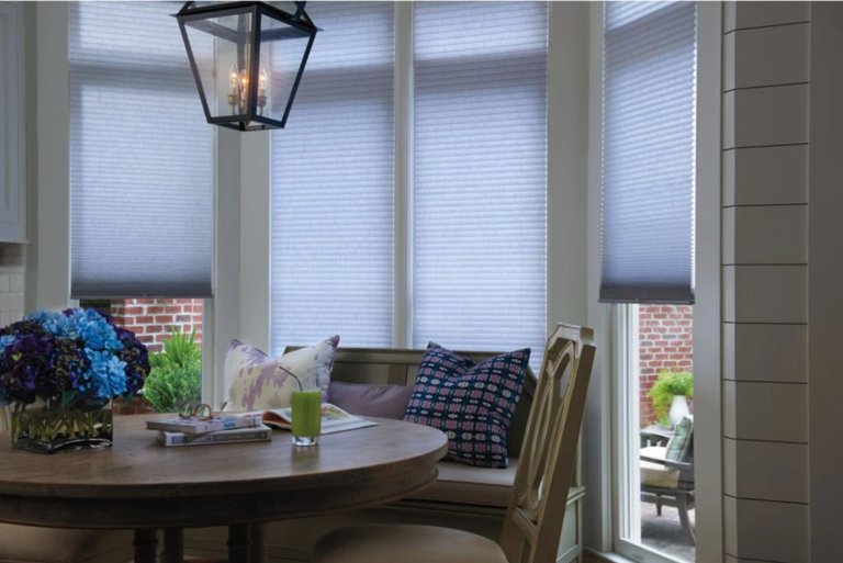 Levolor's Light-Filtering Cellular Shades (in Linen Light Gray) Hang Installed in a Dining Nook