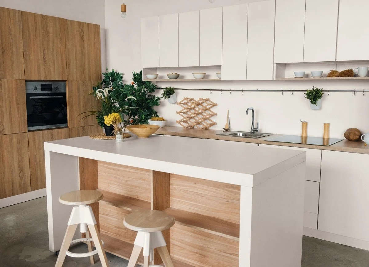 White kitchen with natural wood finishes.