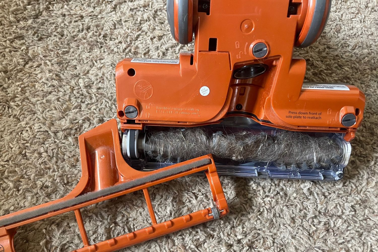 Shark Rocket vacuum head flipped over to show hair and fur on brush roll.