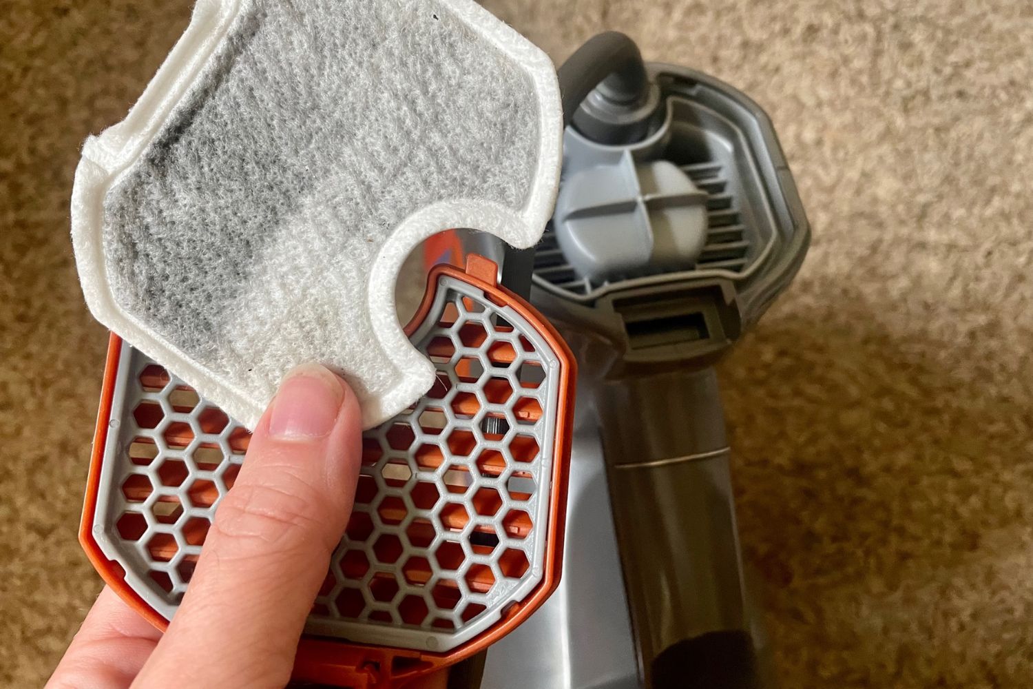 Shark Rocket Pet Corded Stick Vacuum filters filled with dust.
