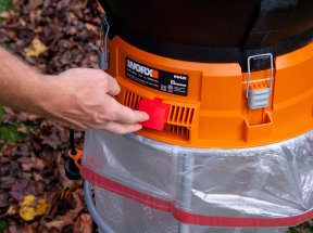 A person turning on the Worx leaf mulcher