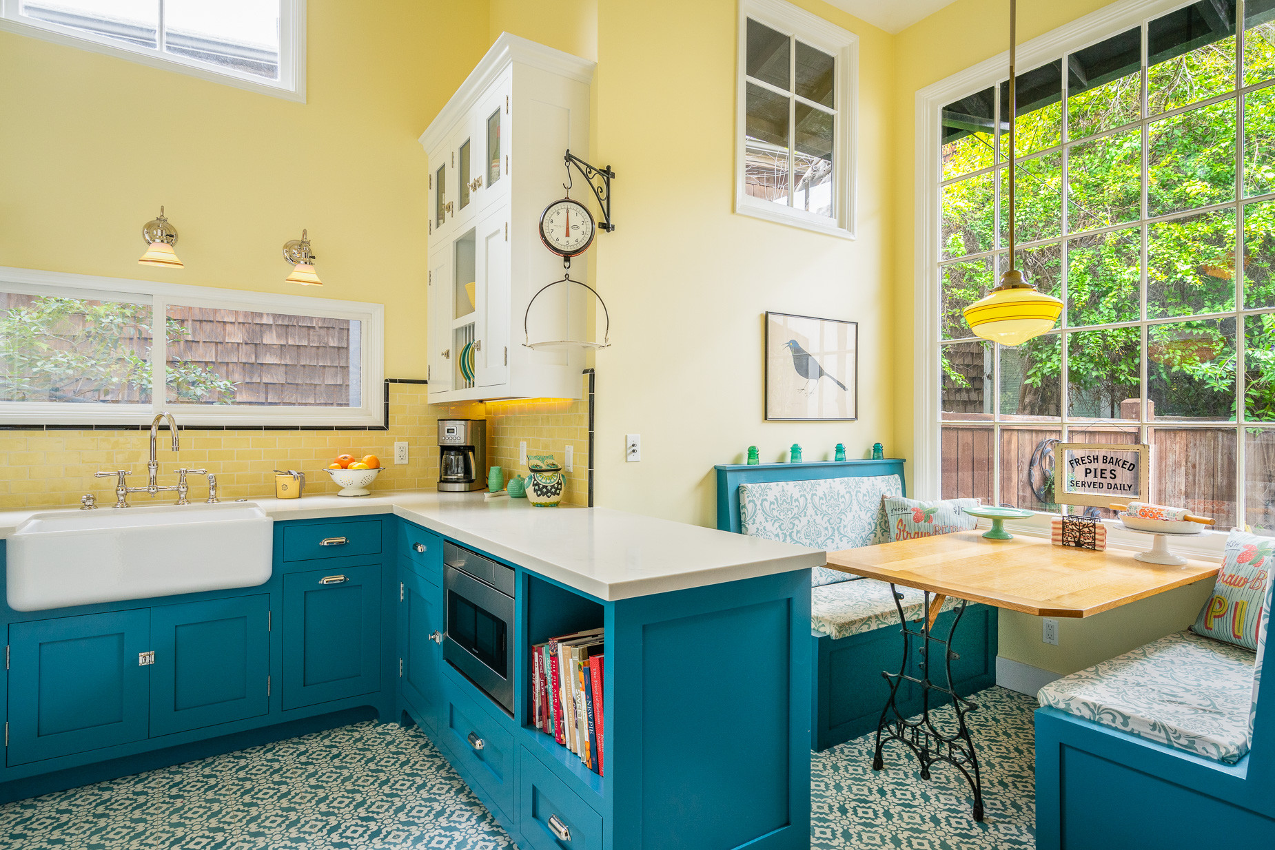 small kitchen with turquoise cabinets and tile