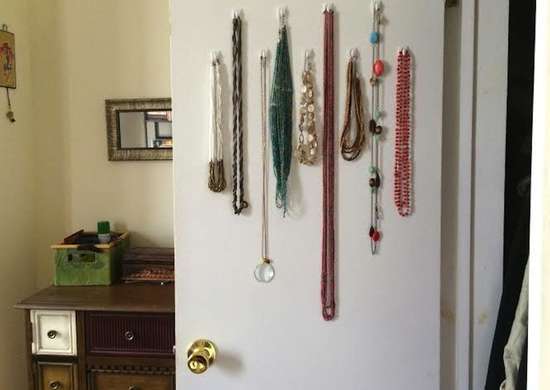 Jewelry hanging on command hooks