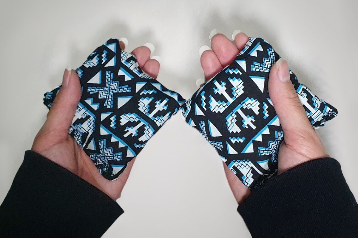 Woman holding hand warmers