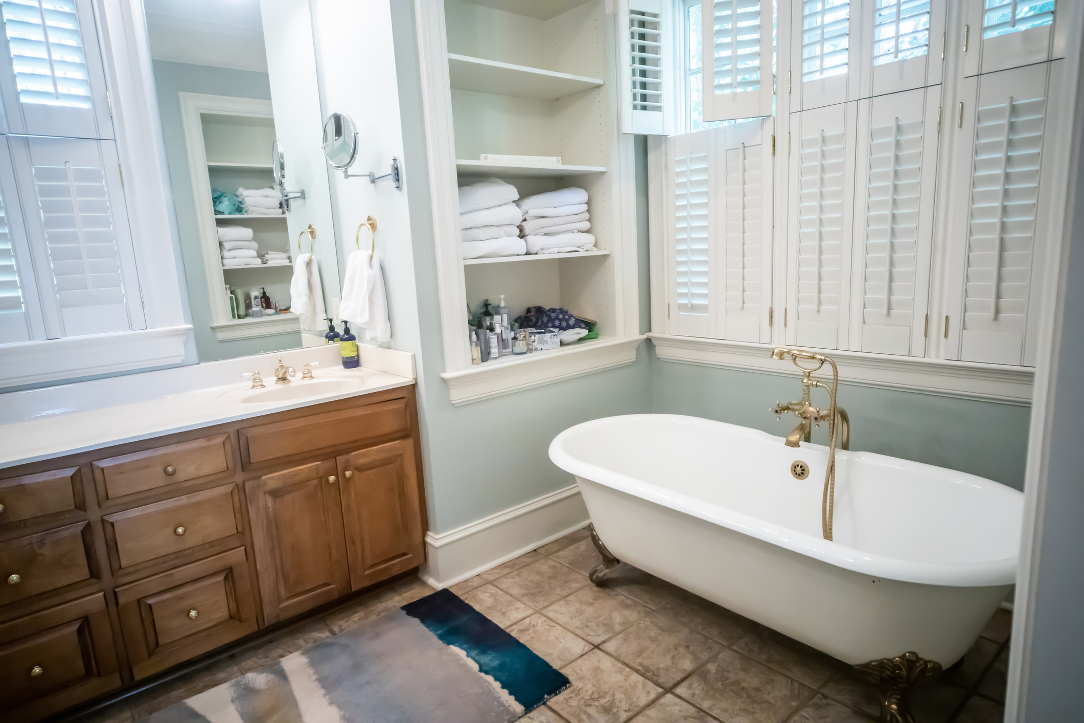 Master Bathroom In a Large Home with Vaulted Ceilings and wood inset cabinets