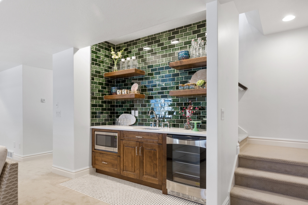 Basement kitchenette with green tile
