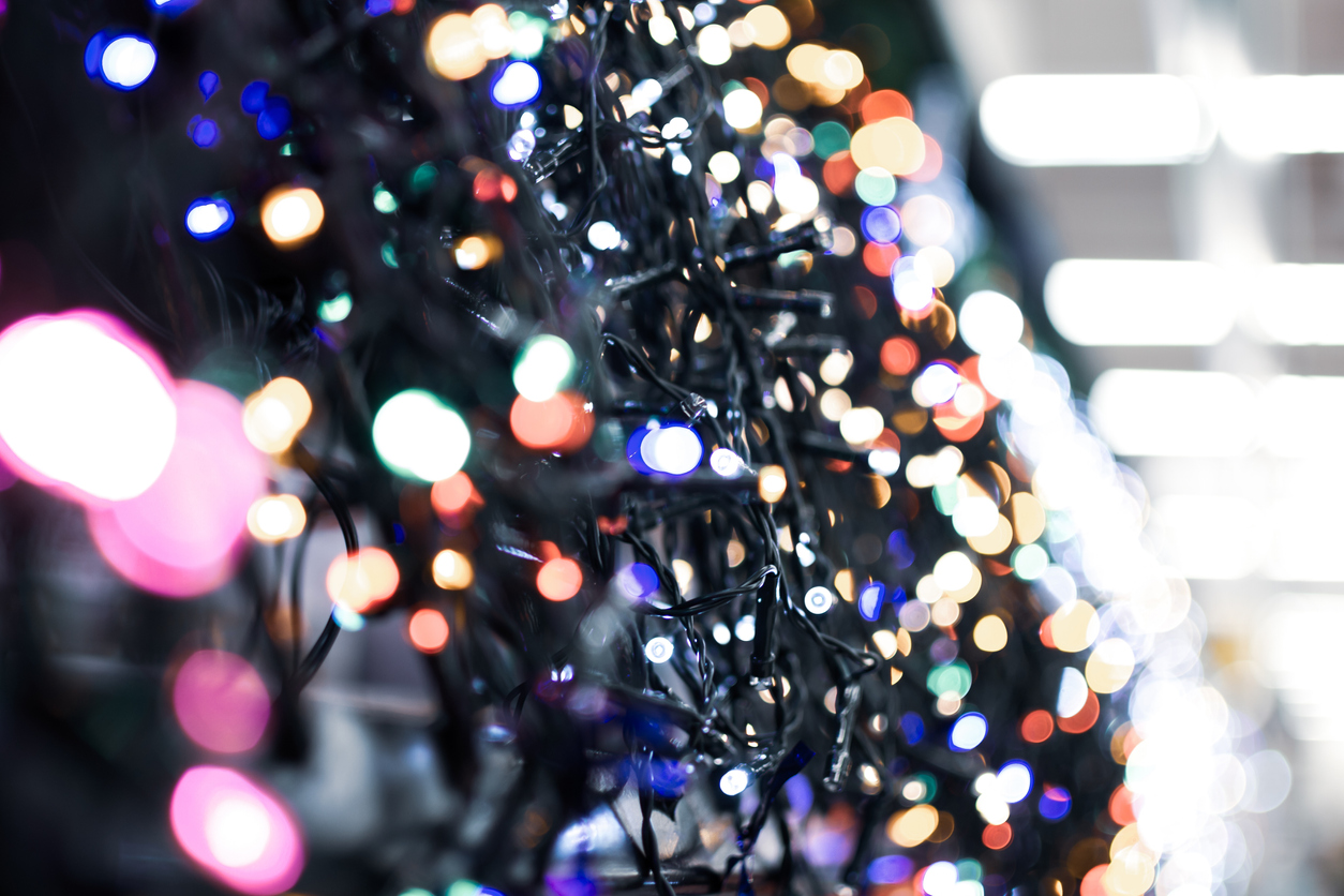 A close view of Christmas light garlands in the supermarket.