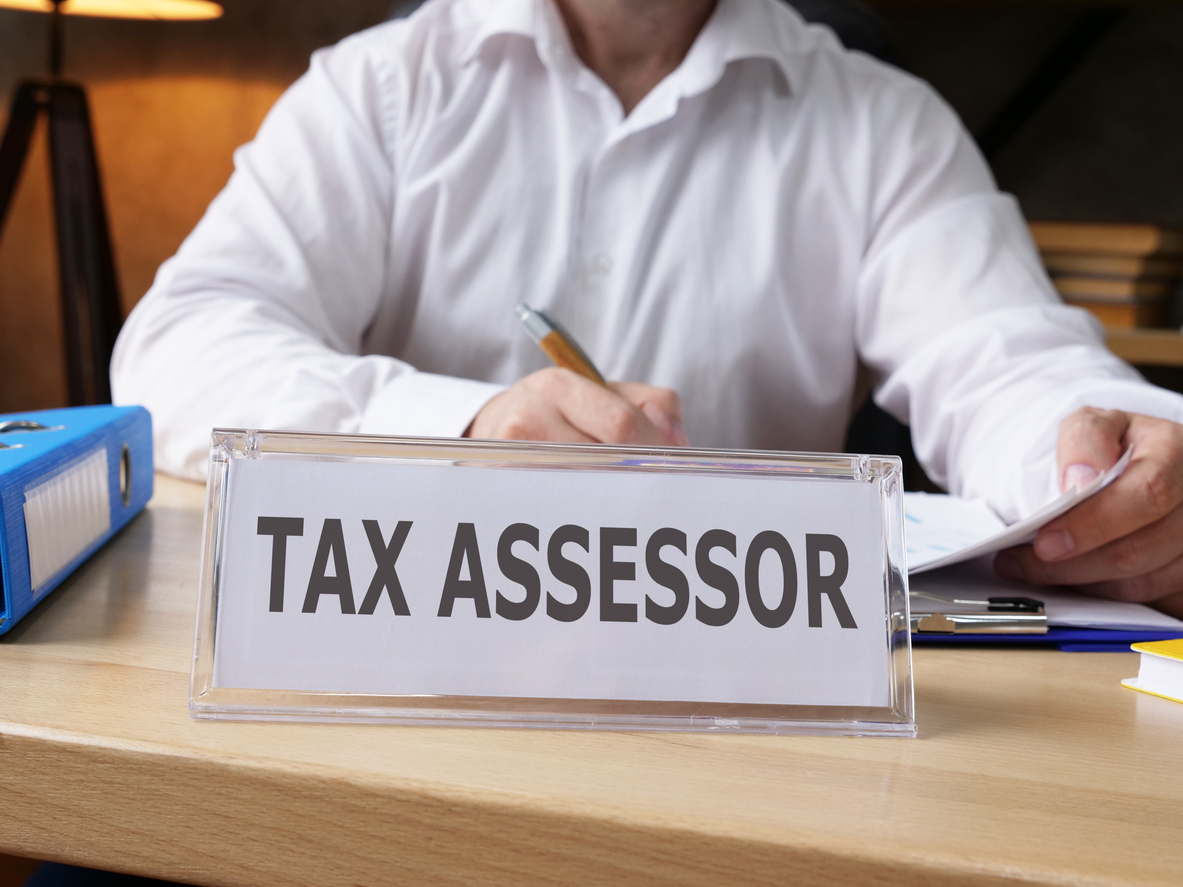 Tax assessor is shown on a business photo using the text