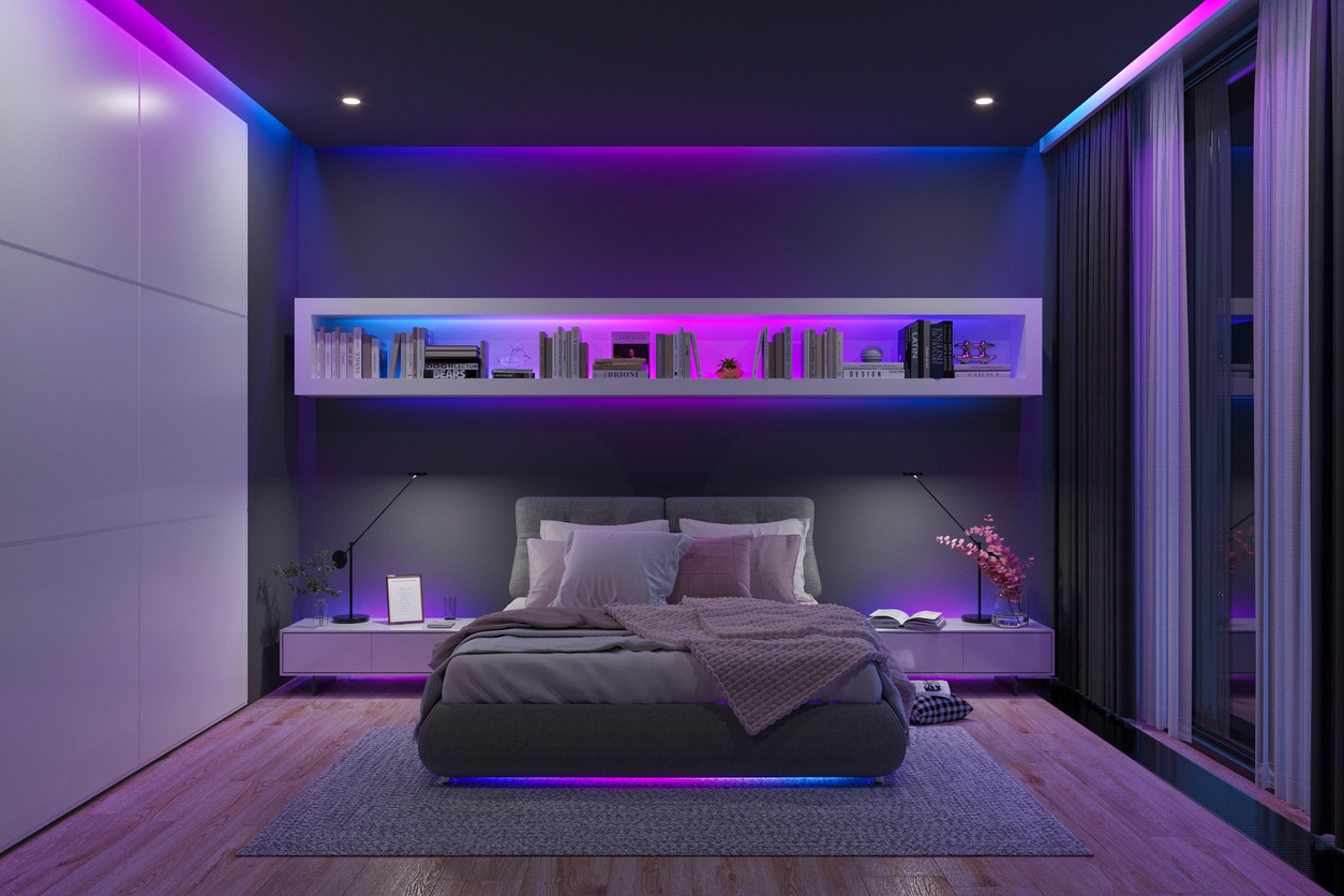 LED-lights-in-blue-and-purple-illuminate-various-places-in-a-modern-bedroom.