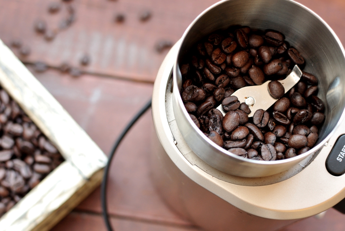 Coffee beans in coffee grinder