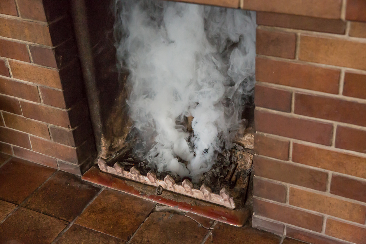 Chimney being tested with a smoke bomb after cleaning - smoke going up the chimney.