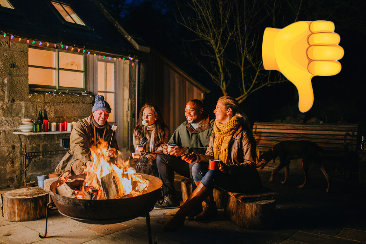 four-adults-sit-around-a-backyard-fire-pit-with-an-emoji-thumbs-down-overlayed