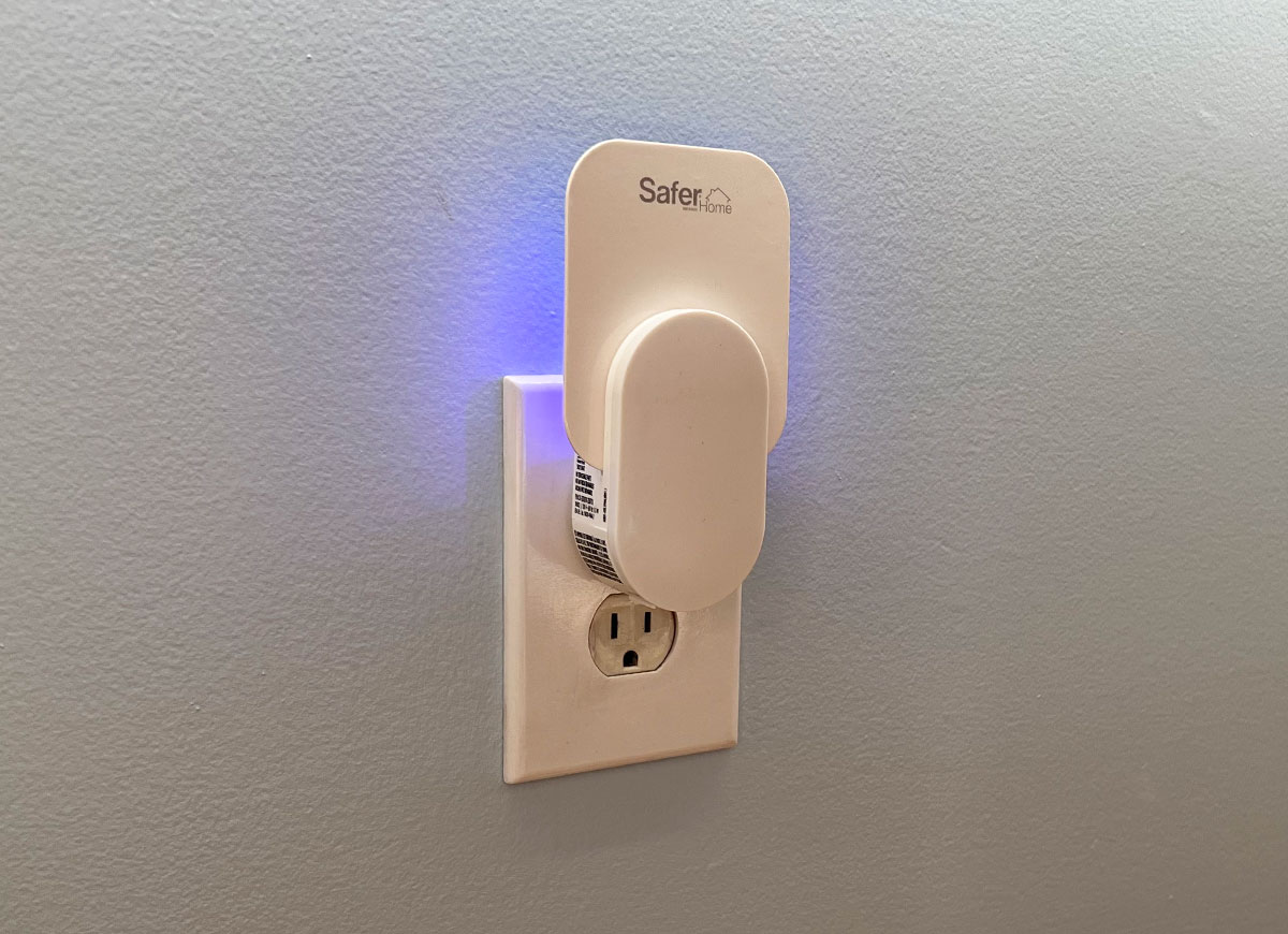 Safer Home indoor LED light bug trap plugged into a wall outlet.