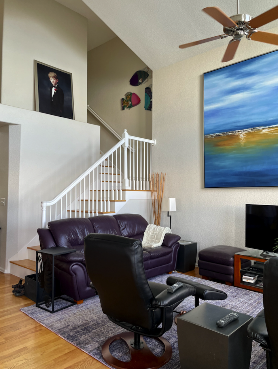 large living room with staircase with grey walls