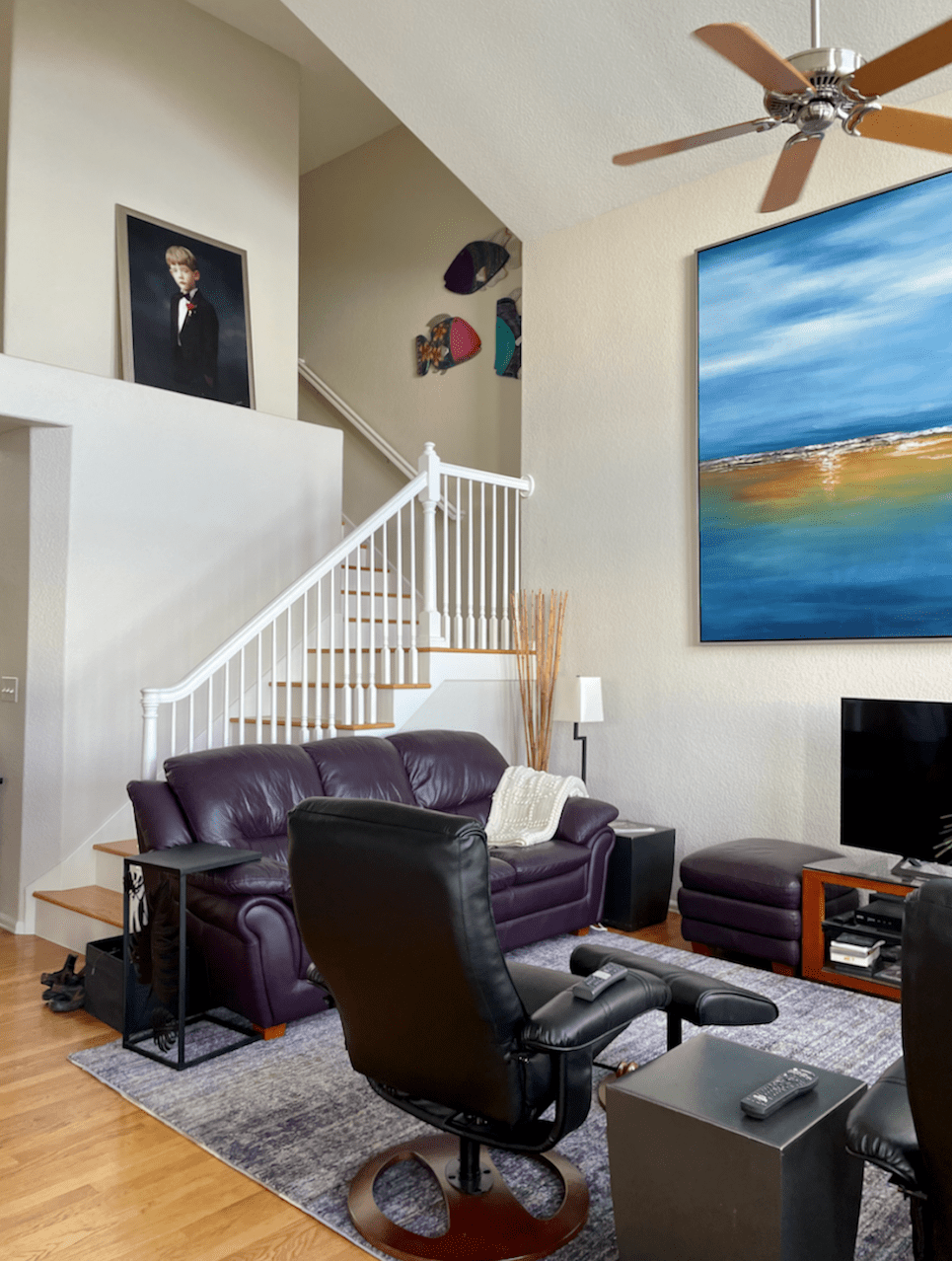 large living room with staircase with grey walls