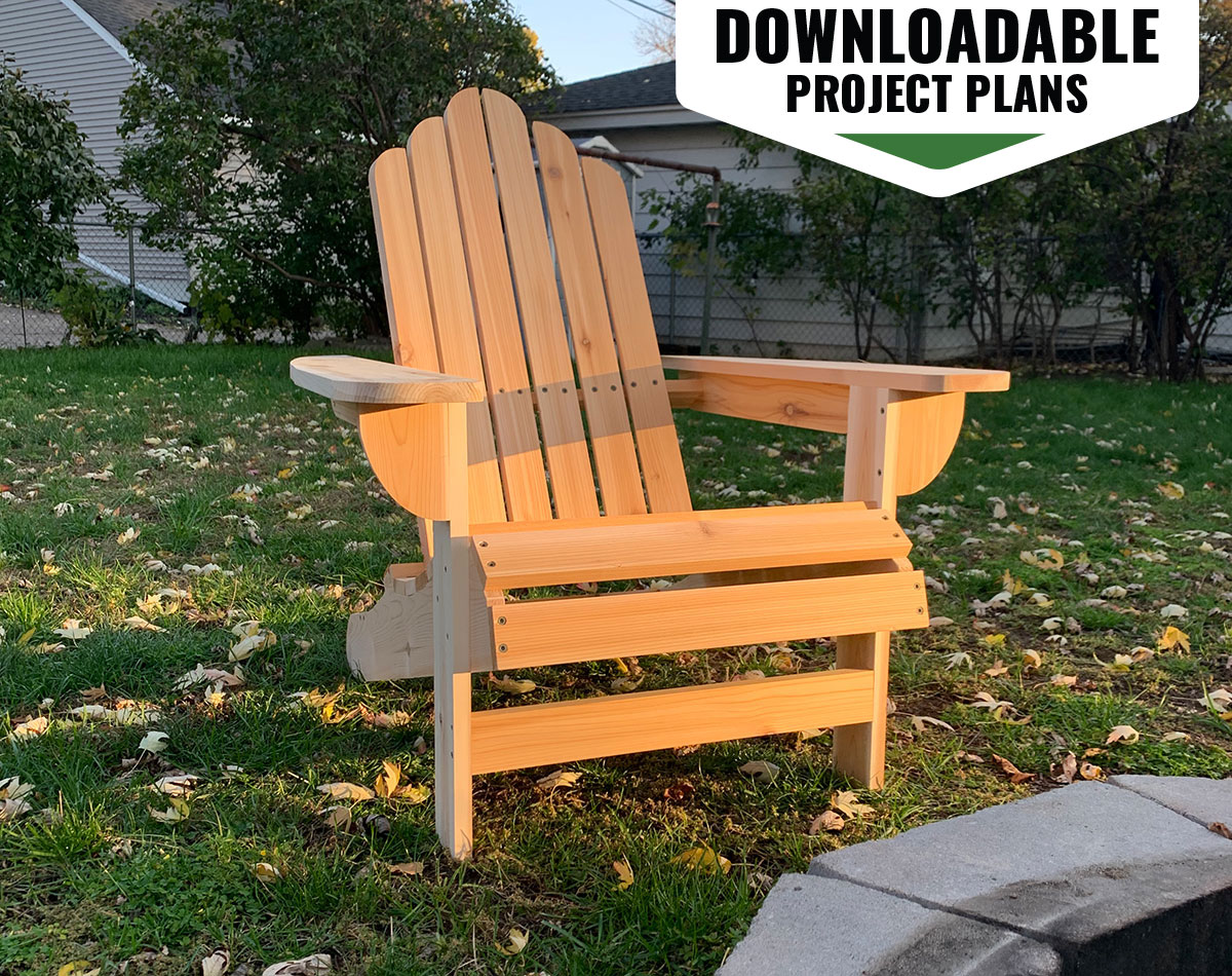 Finished Adirondack chair in a home backyard with a graphic overlay that says downloadable project plans.