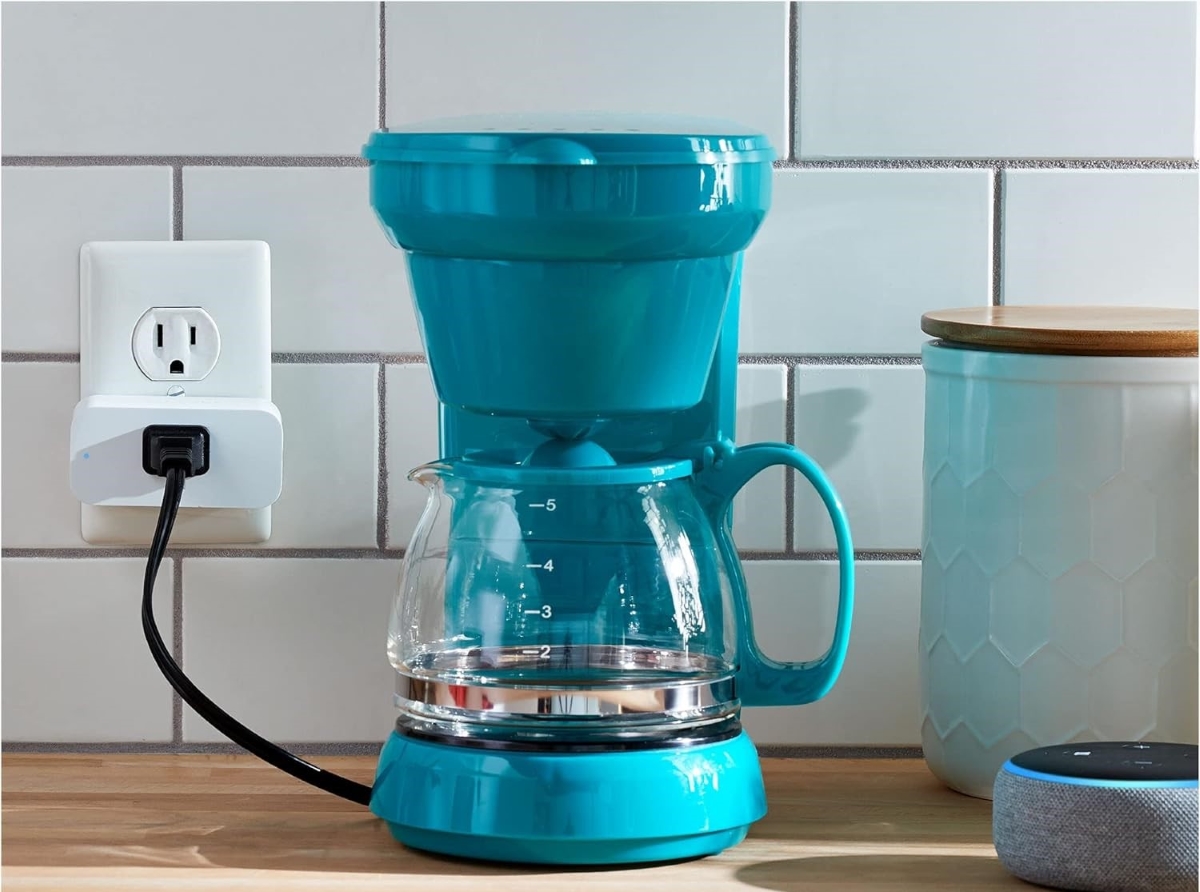Kitchen coffee maker plugged into smart plug.
