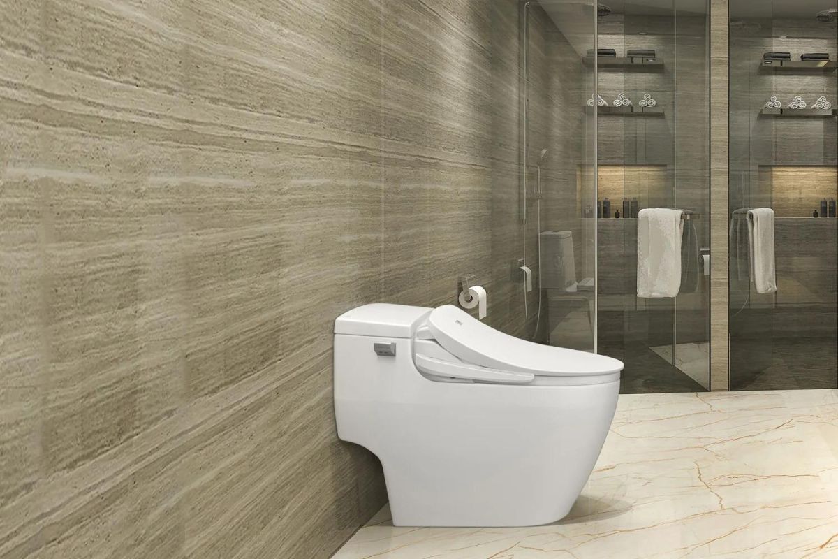 The best bidet toilet seat installed in a large and modern tiled bathroom.