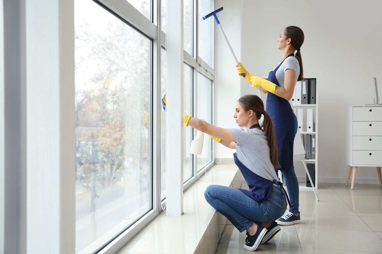 How to Get Clients for a Cleaning Business: Skilled women cleaners diligently providing cleaning services