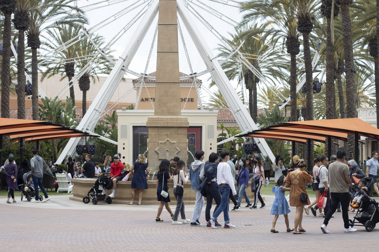 Shoppers at the Irvine Spectrum Center, one of Southern California's popular entertainment and shopping destinations, featuring a 108-foot giant ferris wheel.