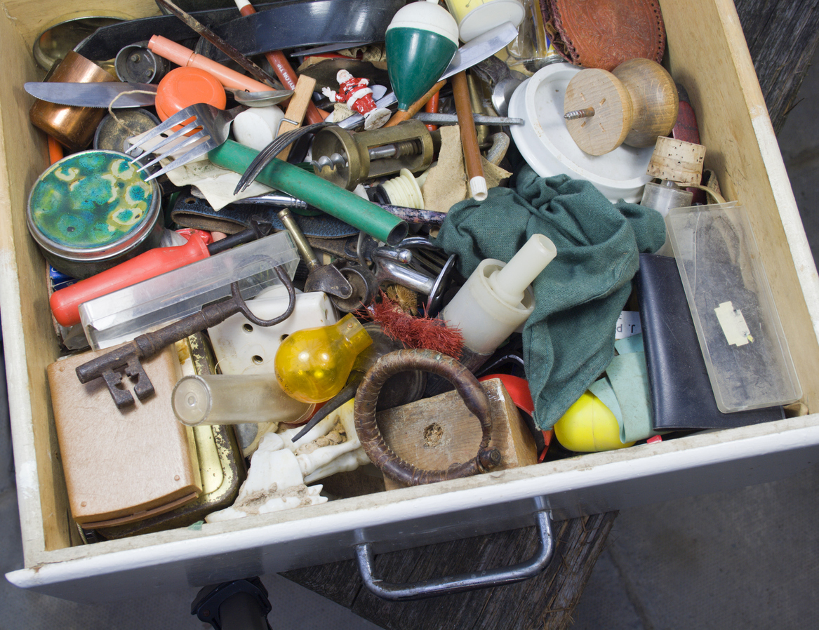 A junk drawer full of eclectic household items.