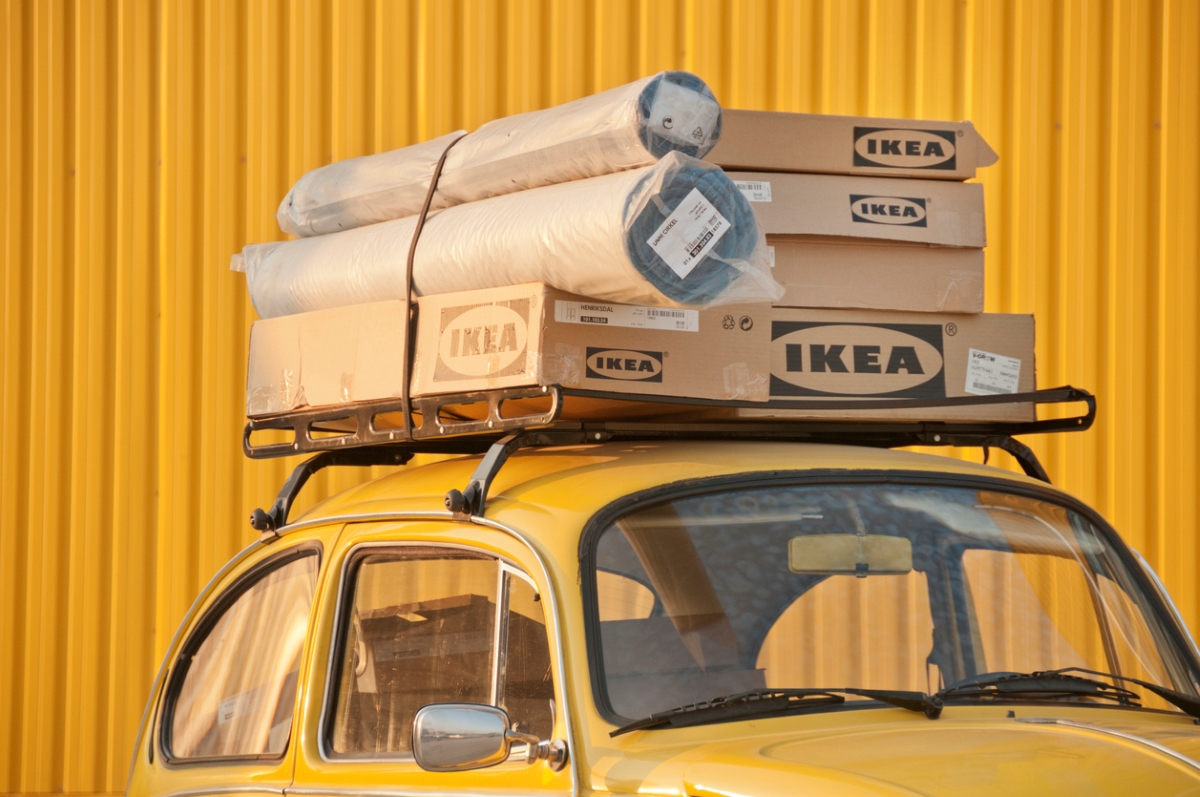 Ikea boxes on top of car.