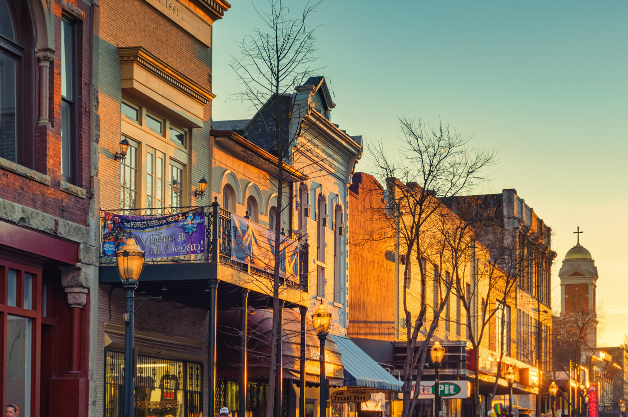 Mobile, USA - February 6, 2015: Historic facades, pubs and restaurants in downtown Mobile, Alabama at sunset.