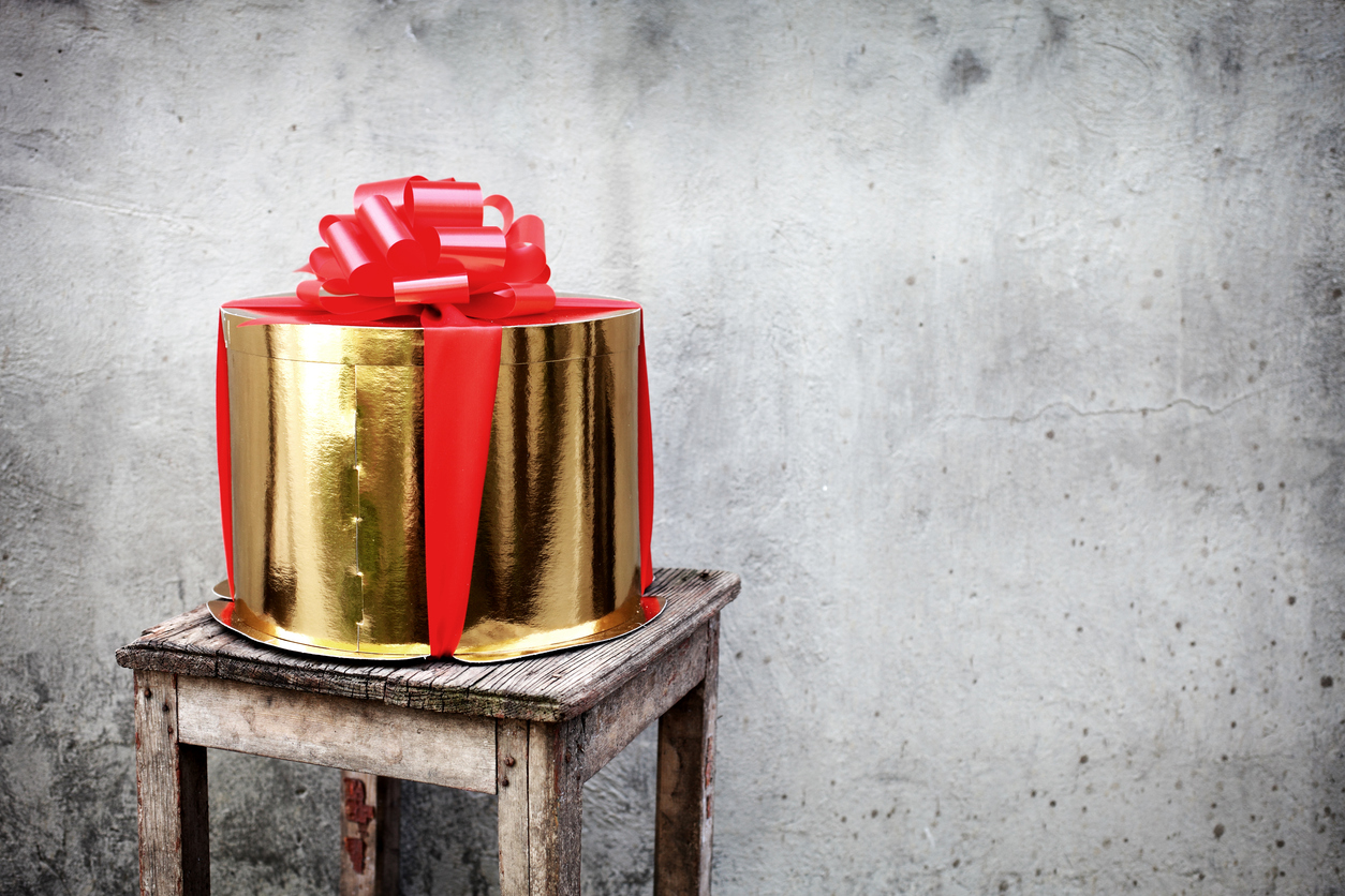 Cylinder-shaped holiday gift.