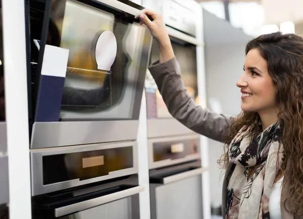 Woman buying new oven