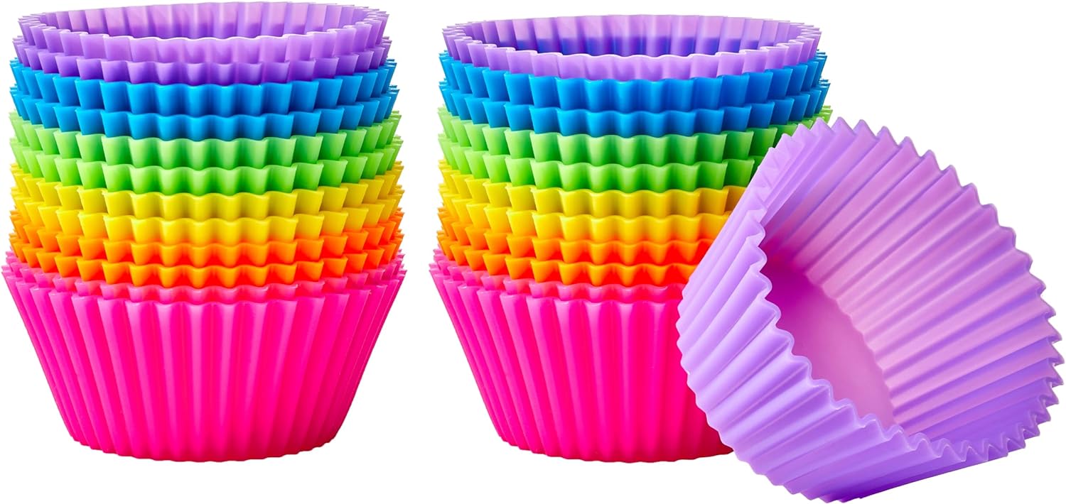 A-collection-of-multi-colored-silicone-baking-cups-sits-in-two-stacks.
