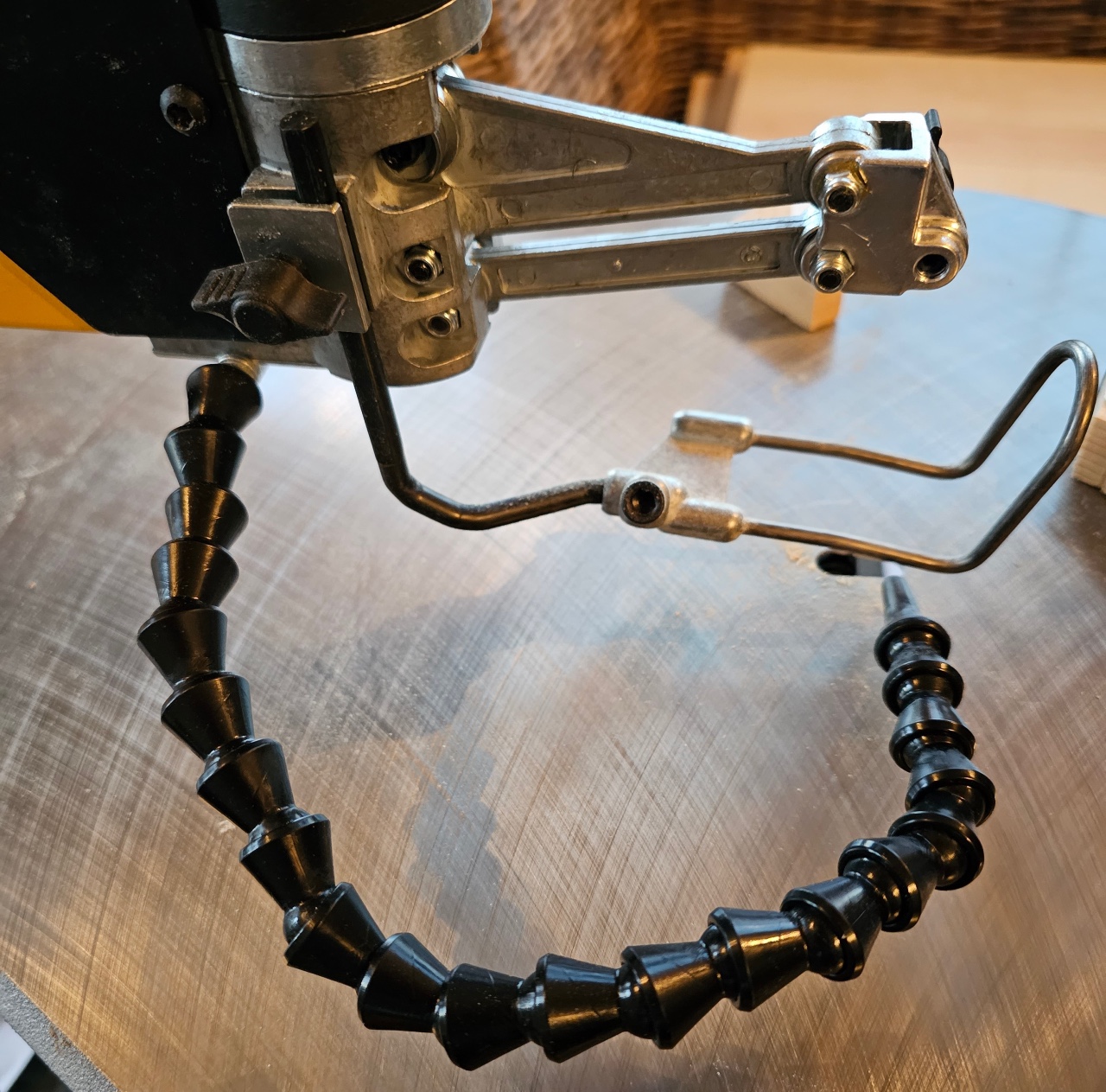 The blade arm and flexible blower on the DeWalt scroll saw.