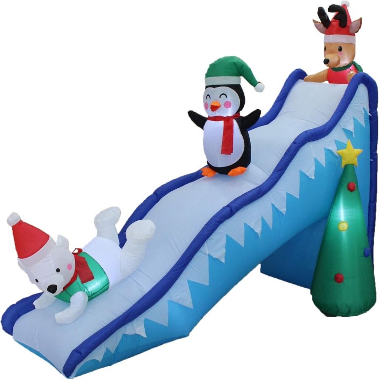Christmas inflatable holiday slide with snowman and penguin.