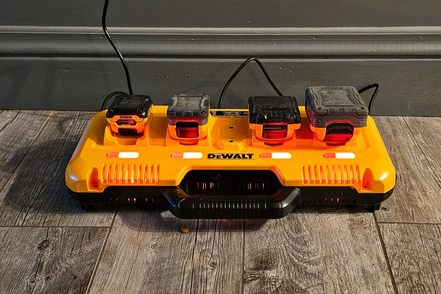 The Dewalt Charging Station with several power tool batteries plugged in for charging.