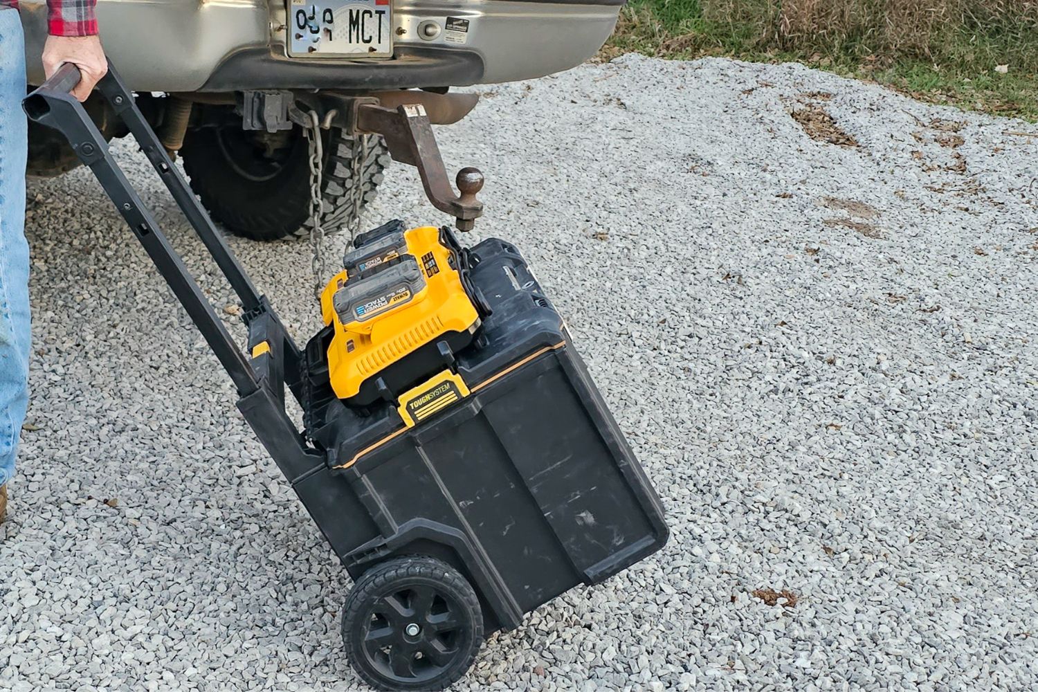 The Dewalt Charging Station on top of a rolling tool box while being wheeled to a jobsite.