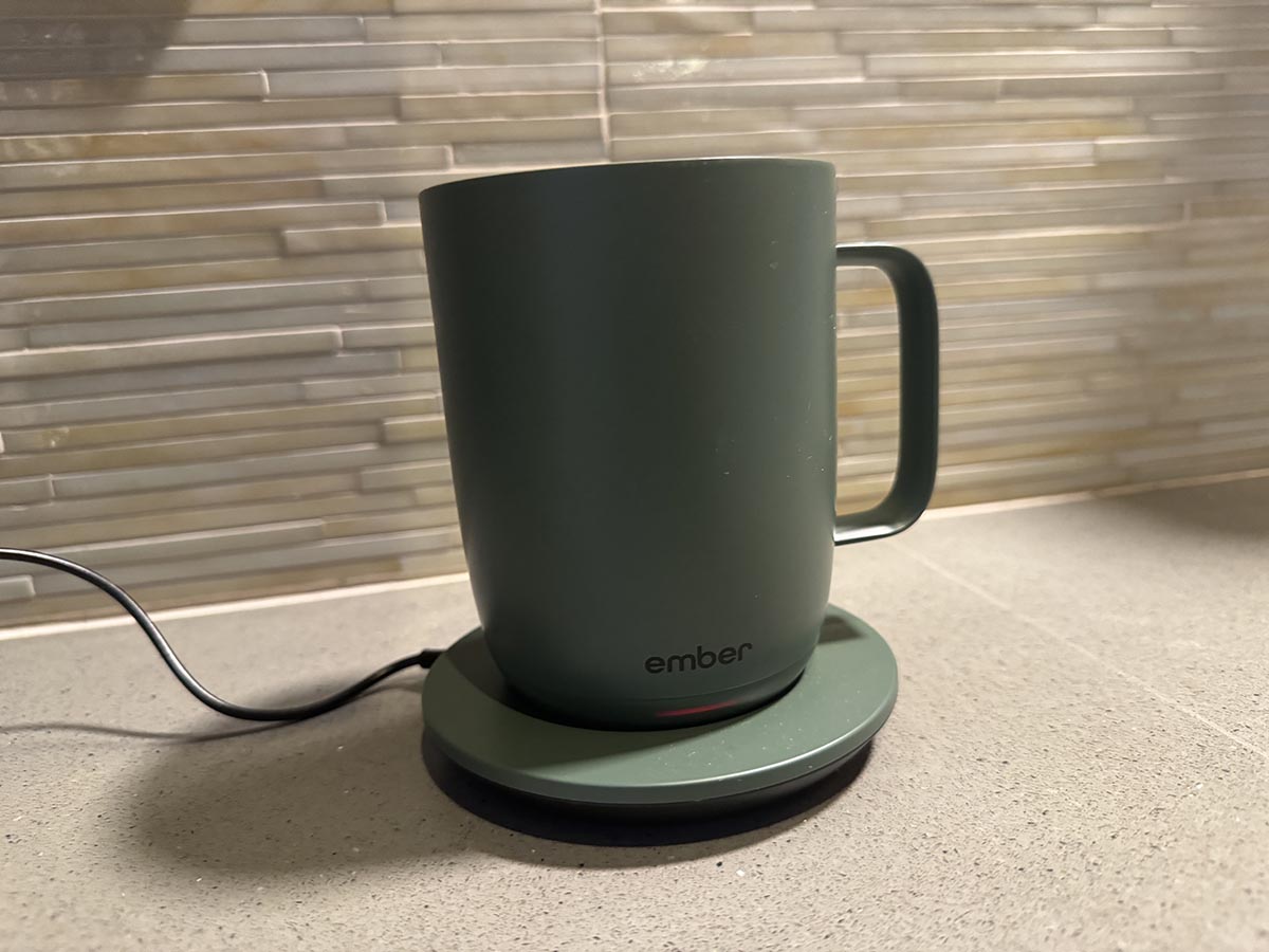 The Ember Mug 2 in sage green on a kitchen counter on its plugged-in charging coaster.The Ember Mug 2 in sage green on a kitchen counter on its plugged-in charging coaster.The Ember Mug 2 in sage green on a kitchen counter on its plugged-in charging coaster.The Ember Mug 2 in sage green on a kitchen counter on its plugged-in charging coaster.The Ember Mug 2 in sage green on a kitchen counter on its plugged-in charging coaster.