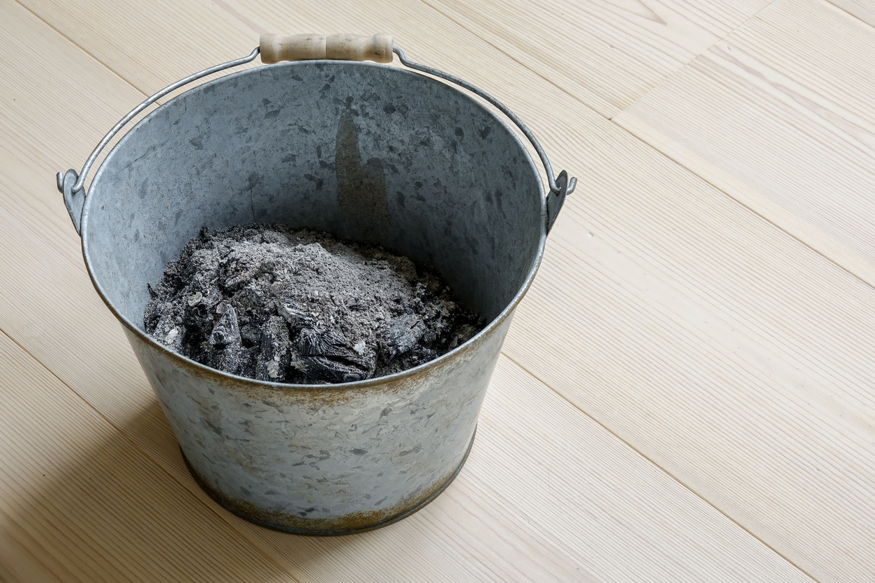A-metal-pail-is-half-filled-with-wood-ashes.